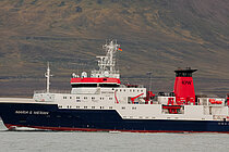 A research vessel with a black hull, white superstructure and red funnel