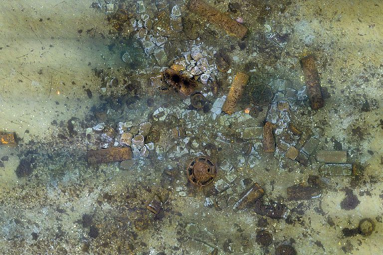Seabed with crates and old ammunition